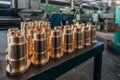 New brass threaded bushings on table in factory Royalty Free Stock Photo