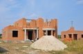 New brick building house construction with doorway columns outdoor. Royalty Free Stock Photo