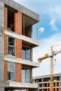 New brick building under construction against cityscape Royalty Free Stock Photo