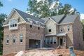New Brick Home Construction with Sandpile Royalty Free Stock Photo