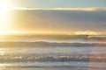 People surfing a New brighton beach during sunrise time. Royalty Free Stock Photo