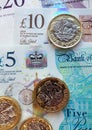 New British plastic banknotes and pound coins Royalty Free Stock Photo