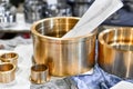 New bronze bushings are on the sheets in the workshop Royalty Free Stock Photo