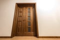 New brown wooden door in house interior Royalty Free Stock Photo