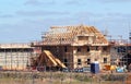 New build house with roof rafters and scaffolding. Royalty Free Stock Photo