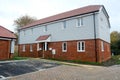 New weather boarded & brick built apartment building.