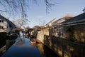 Reflections in a backwater of St Ives, Cambridgeshire, on a clear day Royalty Free Stock Photo