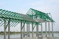 A new build roof with a metal truss framework , color green Royalty Free Stock Photo