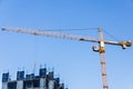 A new building is being constructed with use of tower crane. Jib Royalty Free Stock Photo