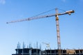 A new building is being constructed with use of tower crane. Jib Royalty Free Stock Photo