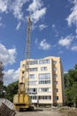 New building, construction crane and blue sky Royalty Free Stock Photo