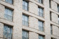 New building facade with covered windows - vacant apartments Royalty Free Stock Photo