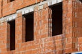 New building of a red brick multi-storey residential building. Background Royalty Free Stock Photo