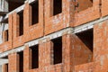 New building of a red brick multi-storey residential building. Background Royalty Free Stock Photo