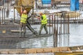 New building under construction and construction site of a residential building. On the site, preparatory work for concreting is b