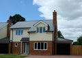 New builds, empty, detached family house. Brick & weatherboard. Royalty Free Stock Photo