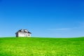 New built house on green meadow under blue sky Royalty Free Stock Photo