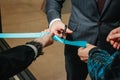 New business enterprise, opening, cutting a blue ribbon with scissors close-up Royalty Free Stock Photo