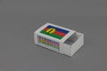 New Caledonia flag on white box with barcode and the color of nation flag on grey background, paper packaging for put match or Royalty Free Stock Photo