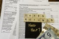 New Canadian personal tax forms and letter tiles showing refunds and taxes