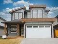 New Canadian Subdivision Home Grey Front Exterior Maison House Cloudy Sky Background Royalty Free Stock Photo