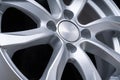New car alloy wheel, over black background, close up the spokes of the disc Royalty Free Stock Photo