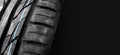 New car tires with colored lines on the tread , car tyre horizontal banner with copy space on the right for text
