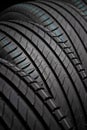 New car tires. Group of road wheels on dark background. Summer Tires with asymmetric tread design Royalty Free Stock Photo