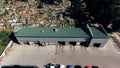 New car wash stands in front of the old cemetery. Aerial view Royalty Free Stock Photo