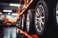 New car wheel and tires on tire storage rack for sale at tyre store. Balck rubber car tire with modern tread at auto repair Royalty Free Stock Photo