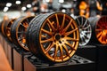 new car wheels with alloy rims are arranged in rows on the store shelf Royalty Free Stock Photo