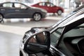 New cars at dealer showroom. Themed blur background with bokeh effect. Car auto dealership. Royalty Free Stock Photo