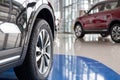 New cars at dealer showroom. Themed blur background with bokeh effect. Car auto dealership Royalty Free Stock Photo