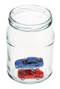 New cars in glass jar Royalty Free Stock Photo