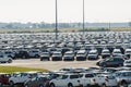 New cars parked at distribution center