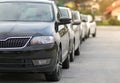 New cars parked in front of a car, motor dealer store, shop in queue Royalty Free Stock Photo