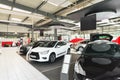New cars in the sales area of a car dealership - building and ar Royalty Free Stock Photo