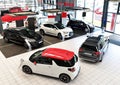 New cars in the sales area of a car dealership - building and ar Royalty Free Stock Photo