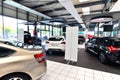 New cars in the sales area of a car dealership - building and ar Royalty Free Stock Photo