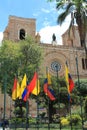 New Cathedral with national and local flags in Cuenca, Ecuador
