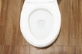 New ceramic white bowl toilet in the bathroom indoors interior, top view. Royalty Free Stock Photo