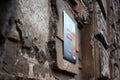 A new certificate sign on wall of very old building