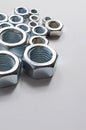 New chrome screw-nut of different sizes Royalty Free Stock Photo