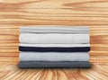 New clothes folded in a pile on a wooden background Royalty Free Stock Photo