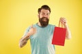 New collection. happy hipster hold paperbag. Man with gift package. Buy product. little pleasantness. bearded man go