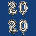 The new color trend of 2020 year. Vertical Christmas composition of number 2020 foil balloons on a classic blue