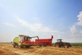 New combine harvester working in field Royalty Free Stock Photo