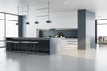 New concrete kitchen interior with panoramic city view, furniture and reflections on floor. Luxury living concept.
