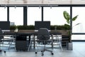 New concrete and wooden office interior with furniture and daylight, window and city view. Royalty Free Stock Photo