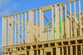 new construction home framing against blue sky, closeup of ceiling frame Royalty Free Stock Photo